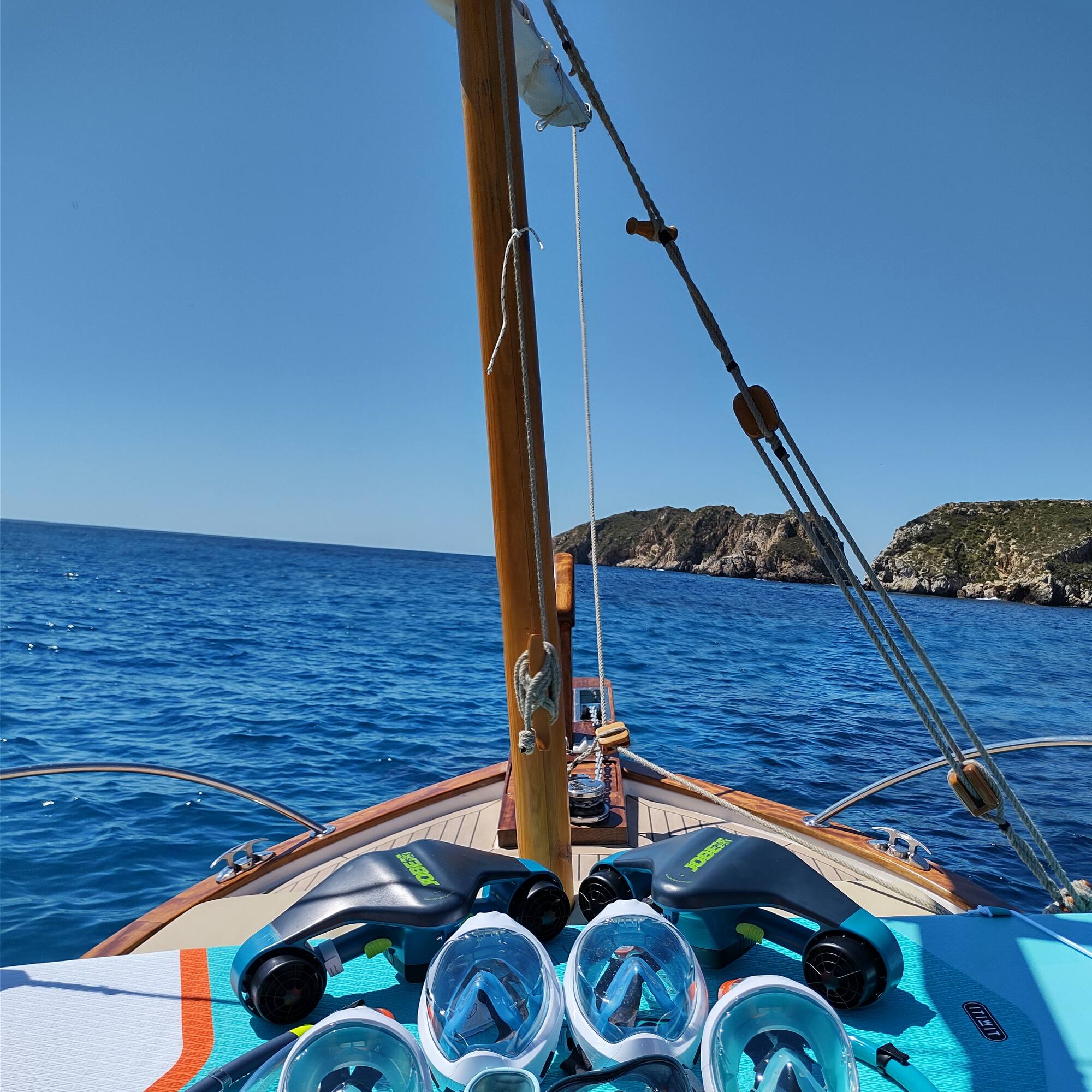 a group of snorkeling gear on a boat