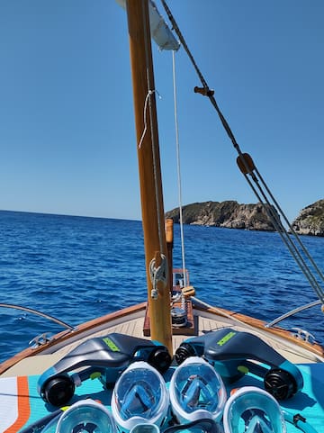 a group of snorkeling gear on a boat