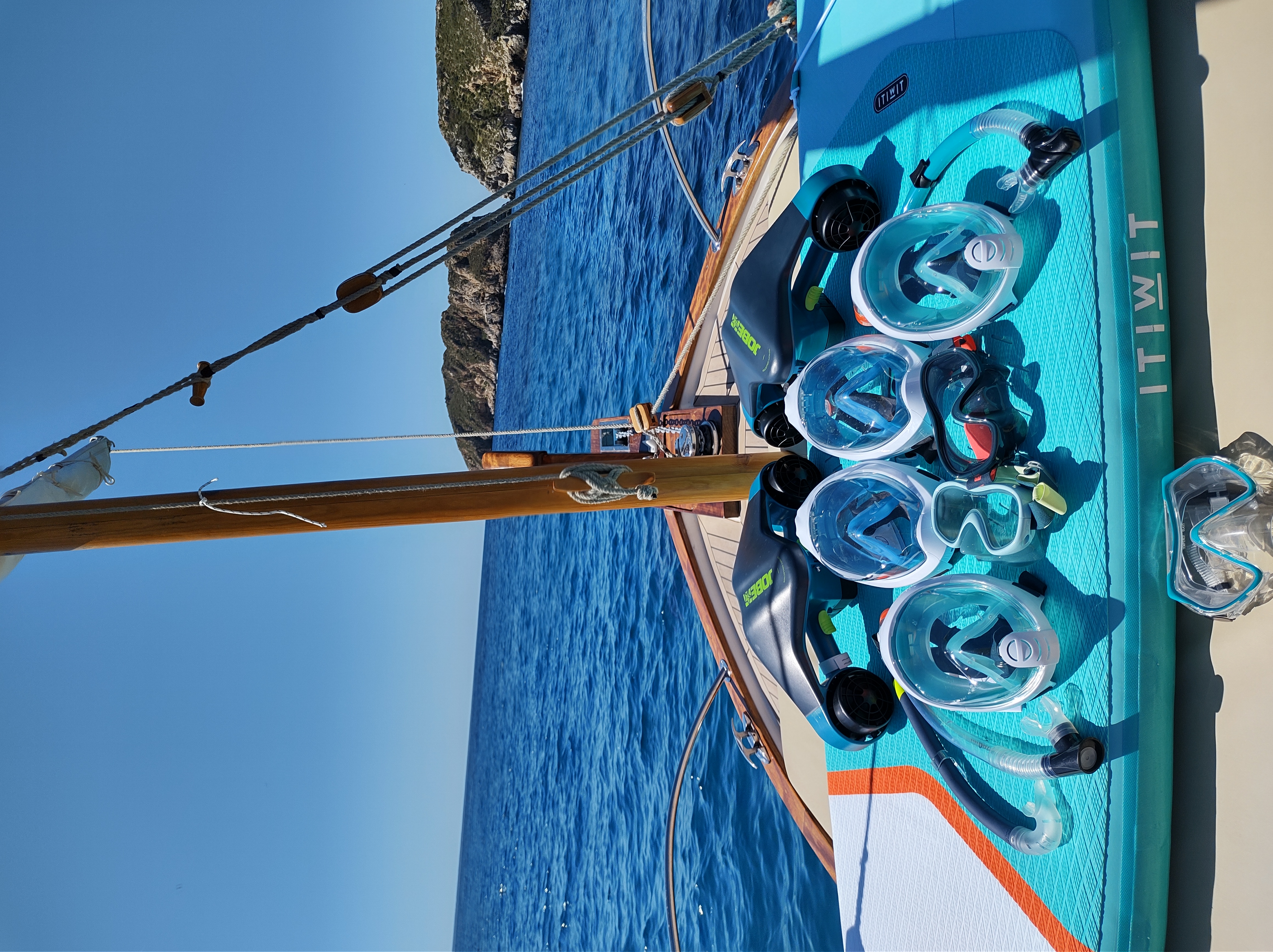 a group of snorkeling gear on a boat