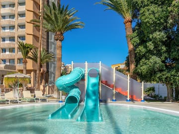 a water slide in a pool