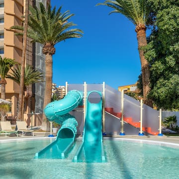 a water slide in a pool