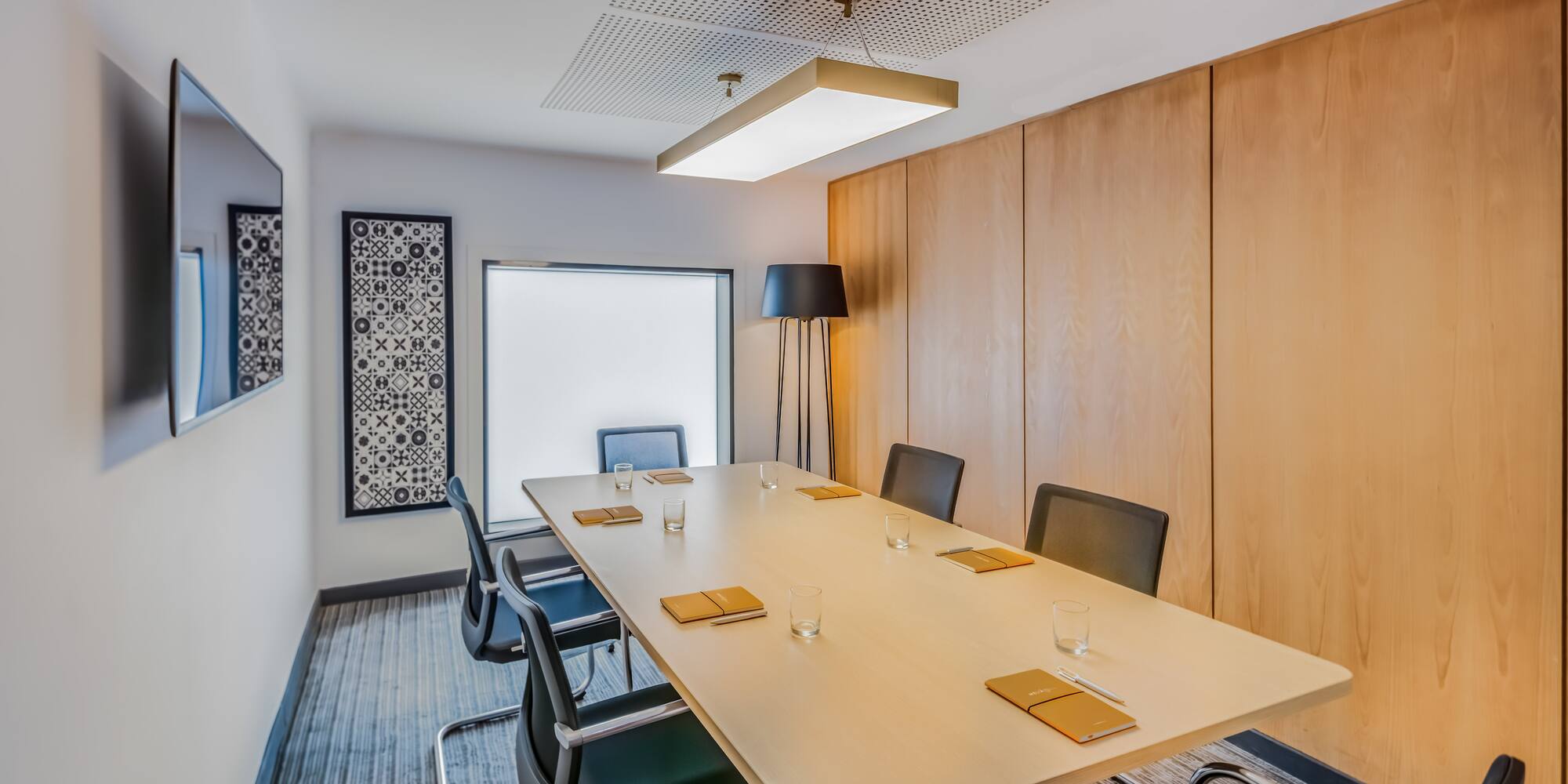 a conference room with a table and chairs