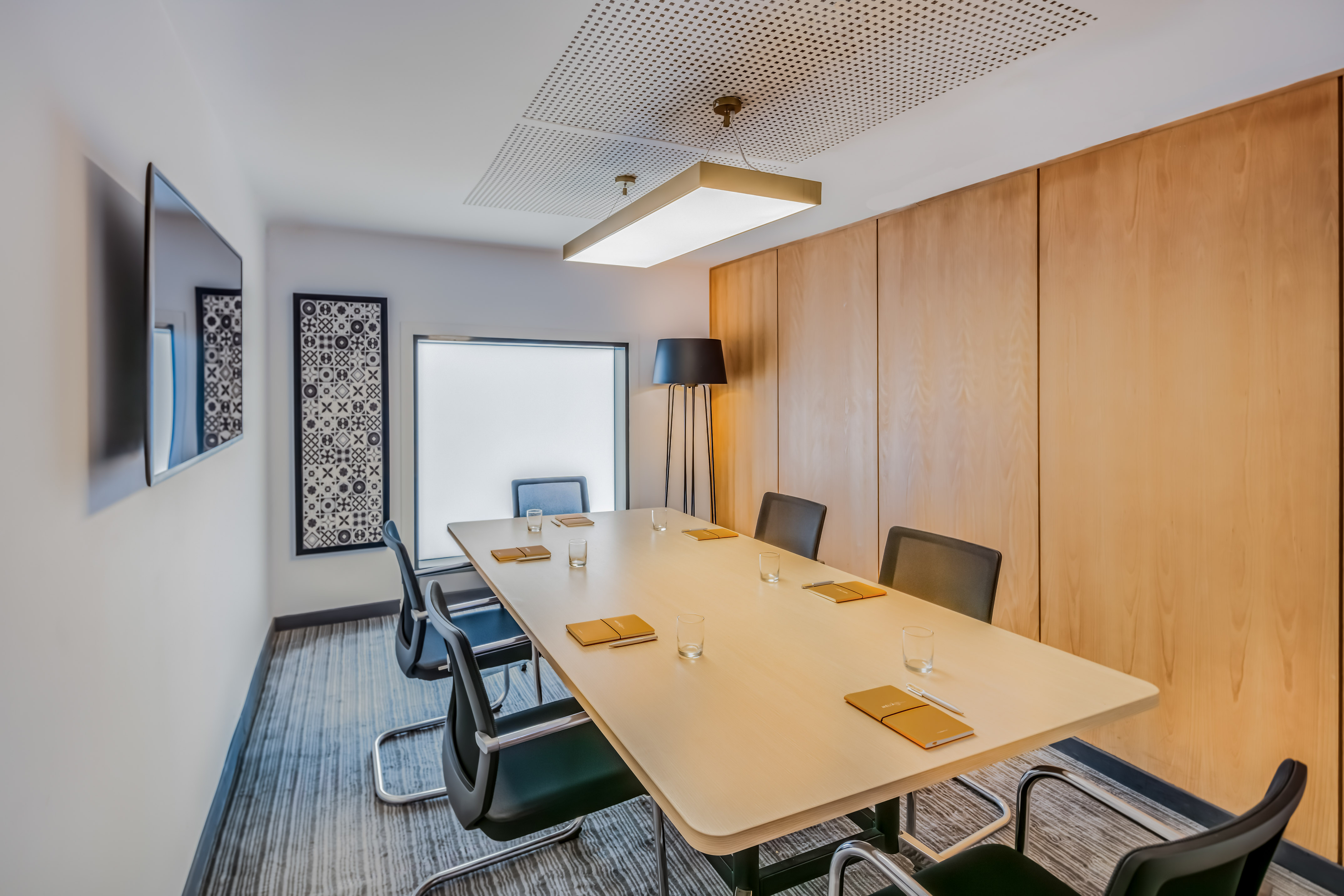 a conference room with a table and chairs