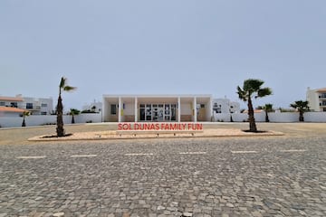 a building with palm trees in front of it