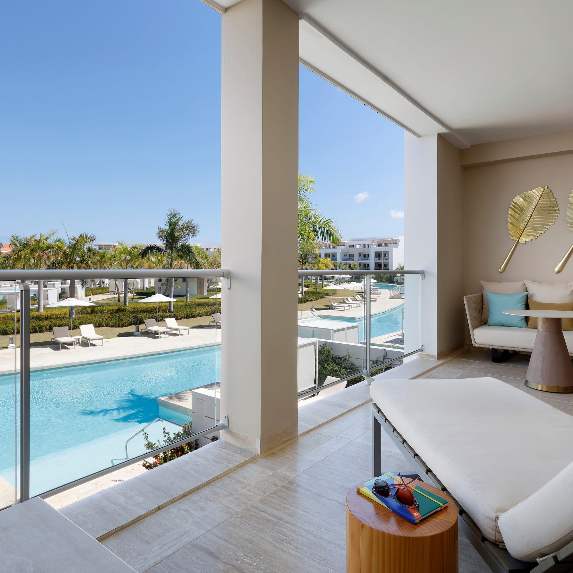 a balcony with a pool and a couch