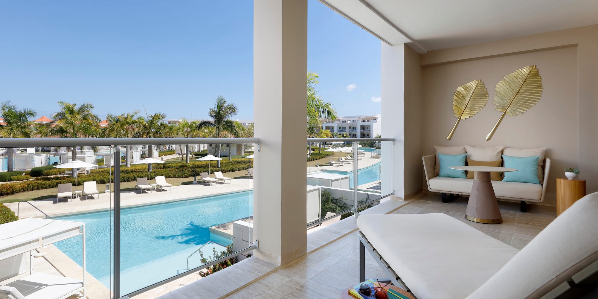 a balcony with a pool and a couch