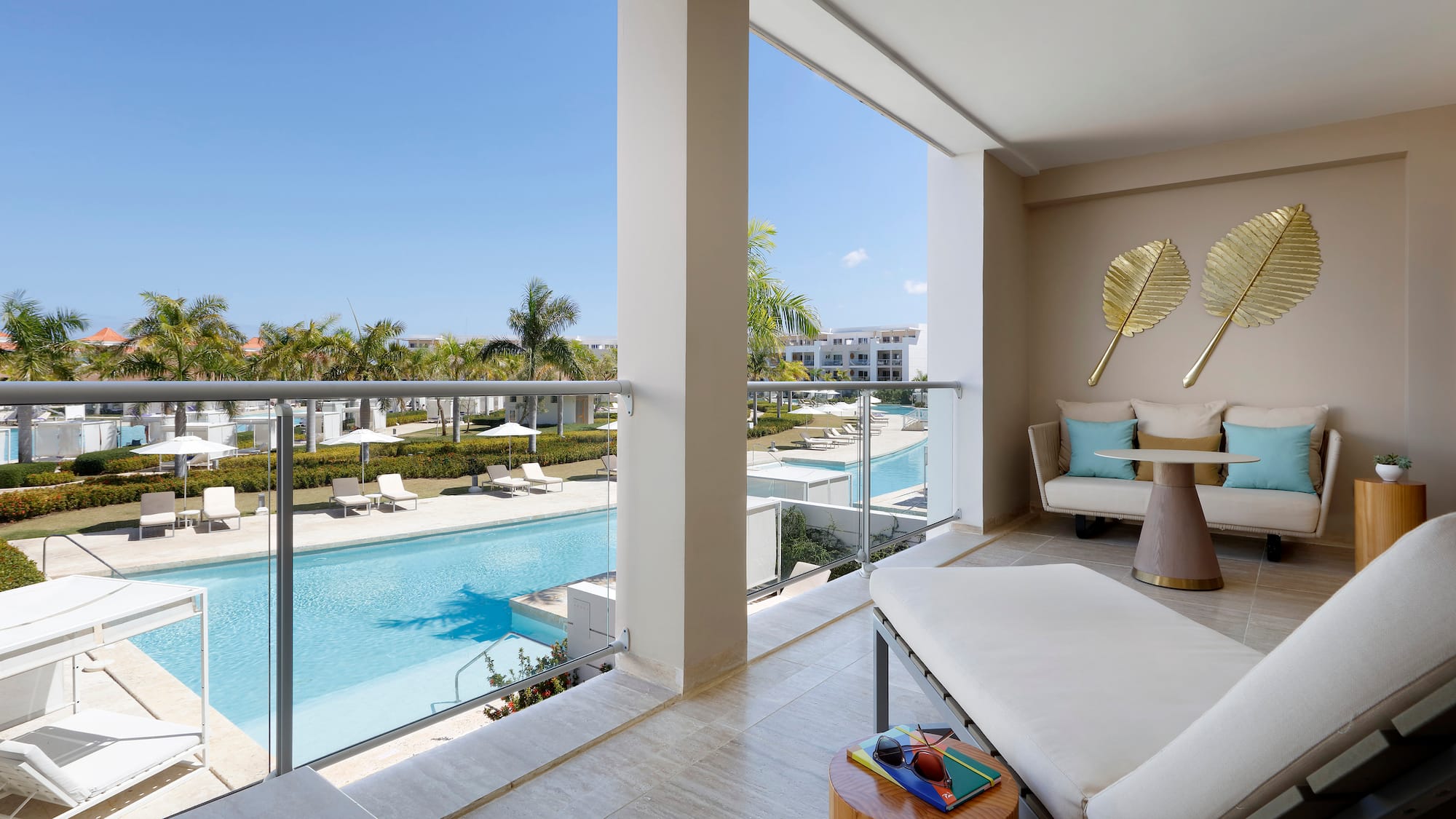 a balcony with a pool and a couch