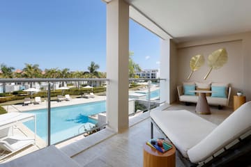 a balcony with a pool and a couch