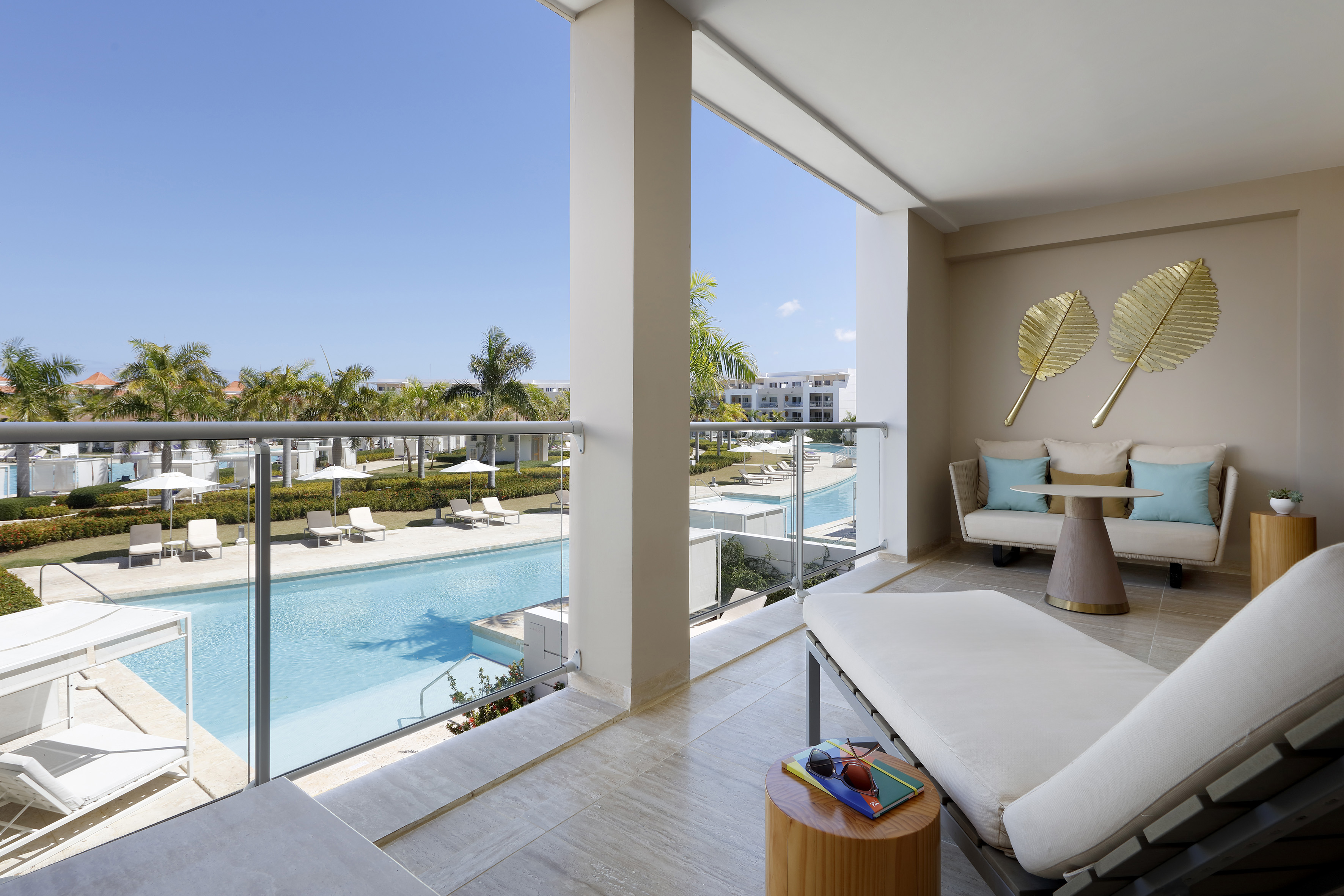 a balcony with a pool and a couch