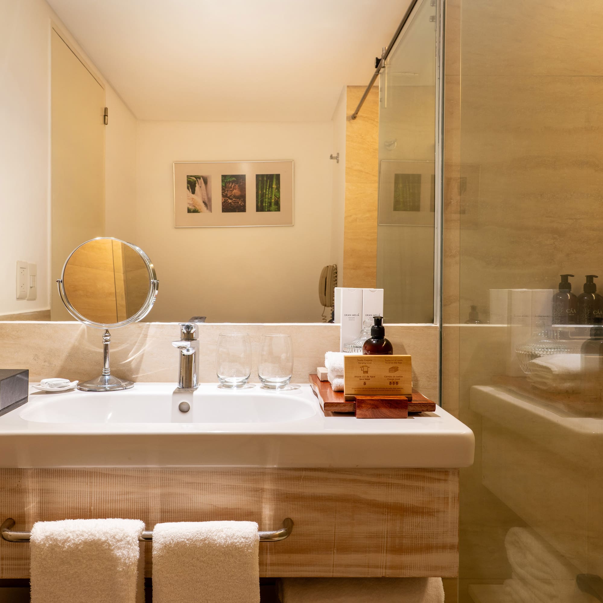 a bathroom with a glass shower door