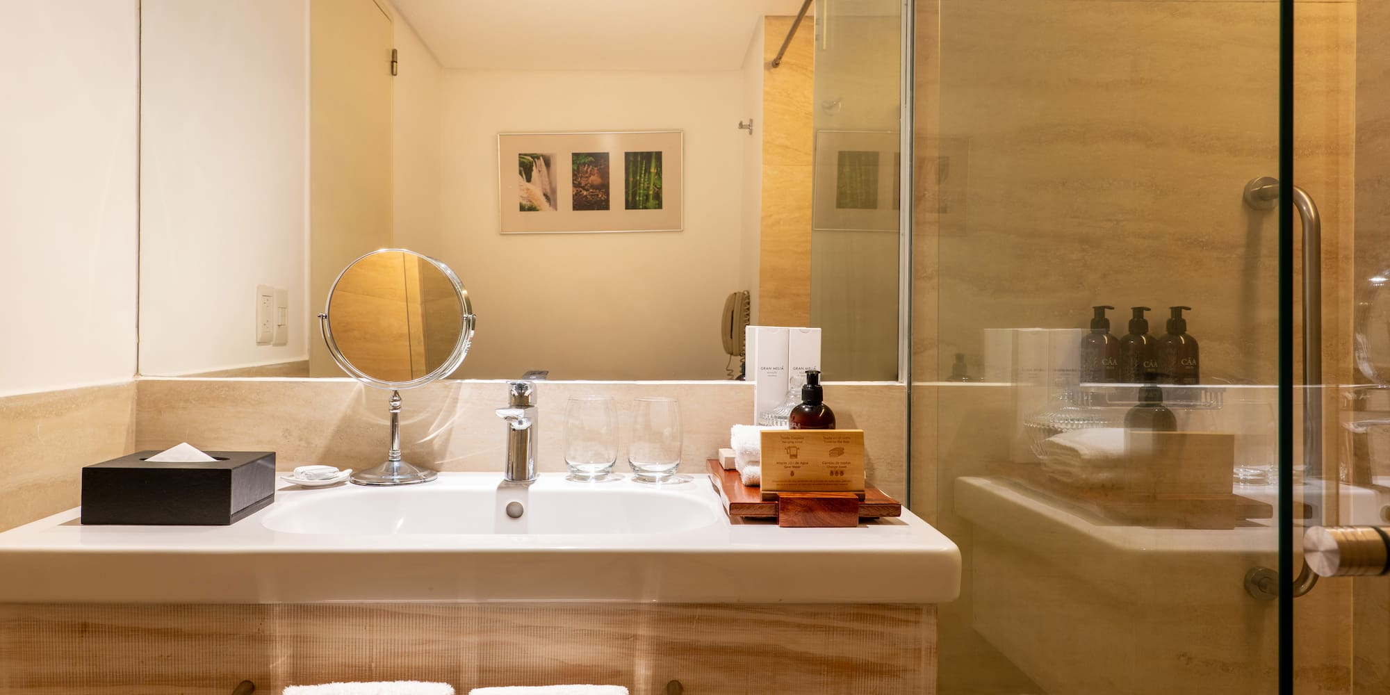a bathroom with a glass shower door