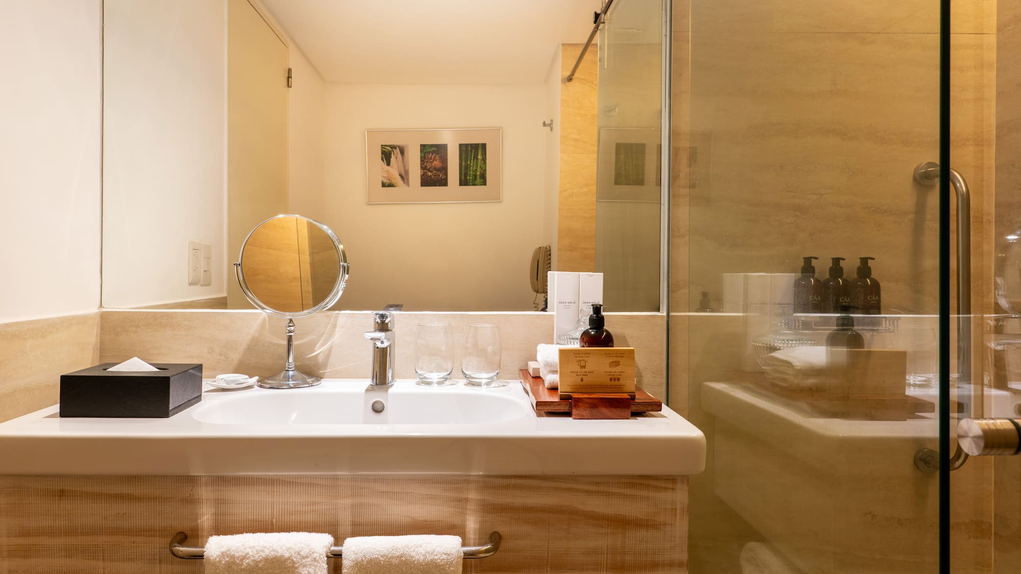 a bathroom with a glass shower door