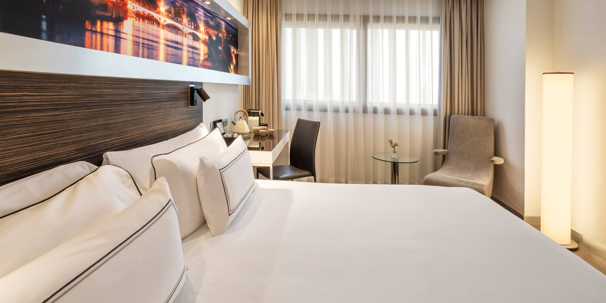 a room with a bed and a chair