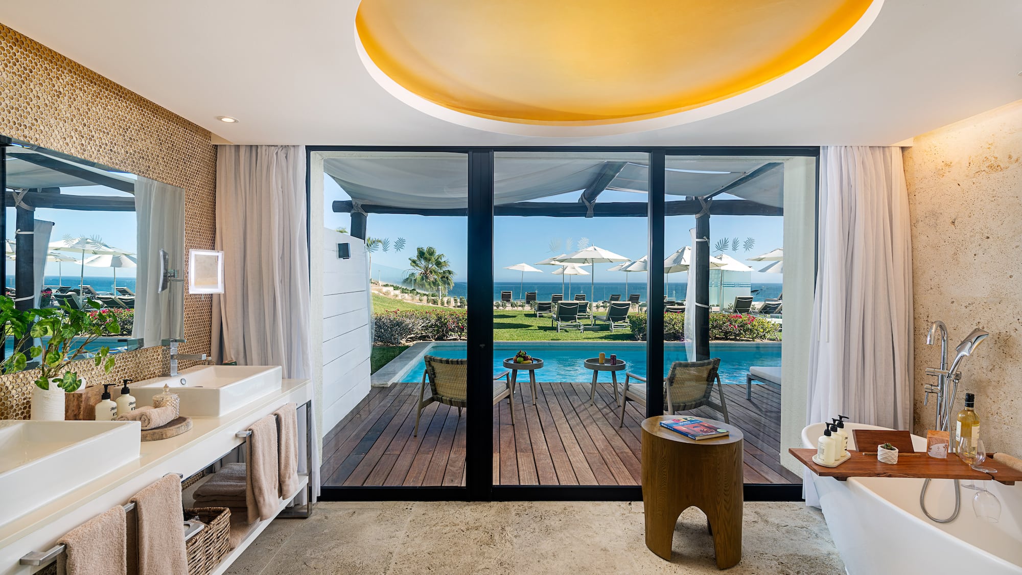 a bathroom with a pool and a deck