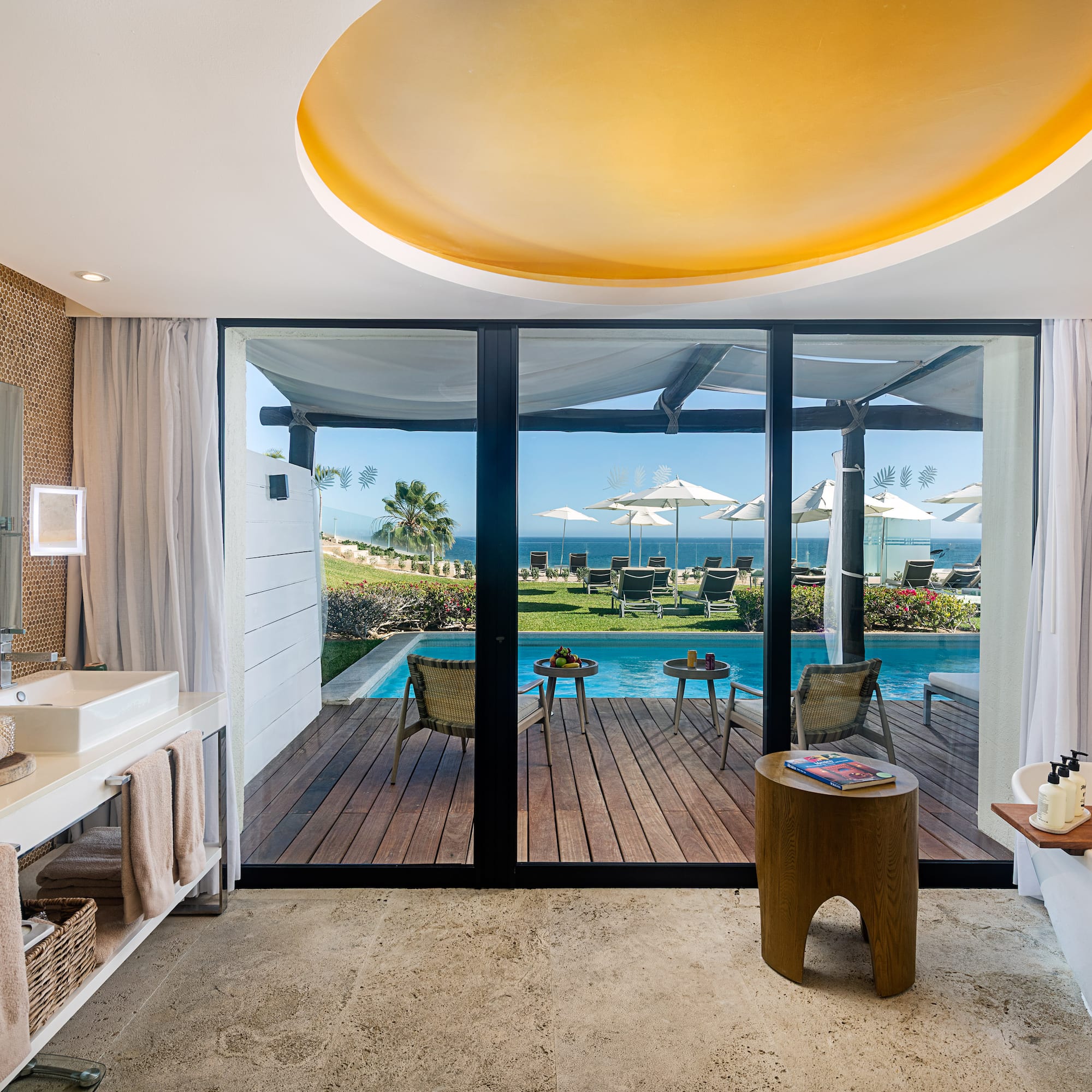 a bathroom with a pool and a deck