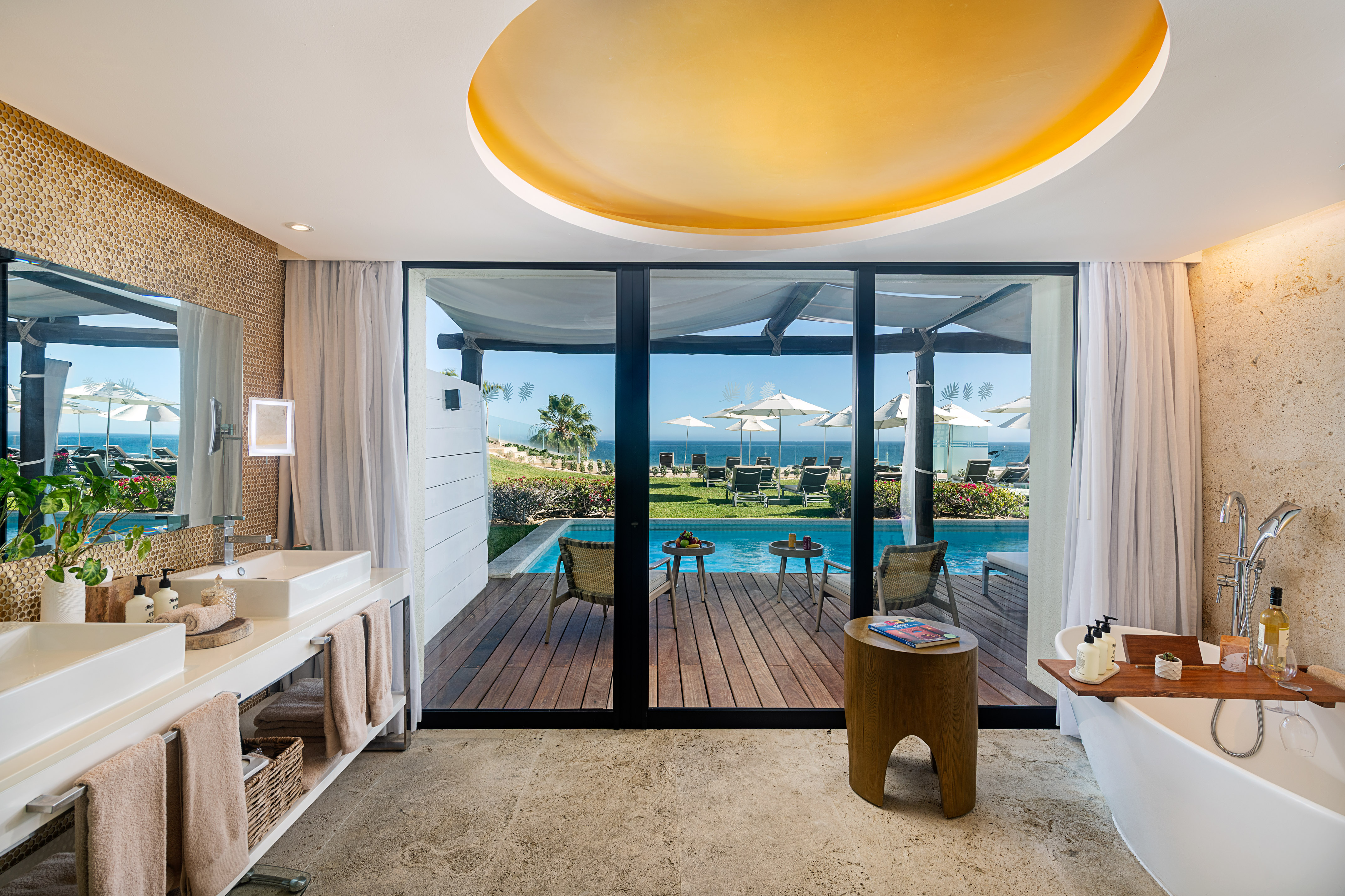 a bathroom with a pool and a deck