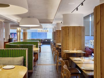 a restaurant with tables and chairs