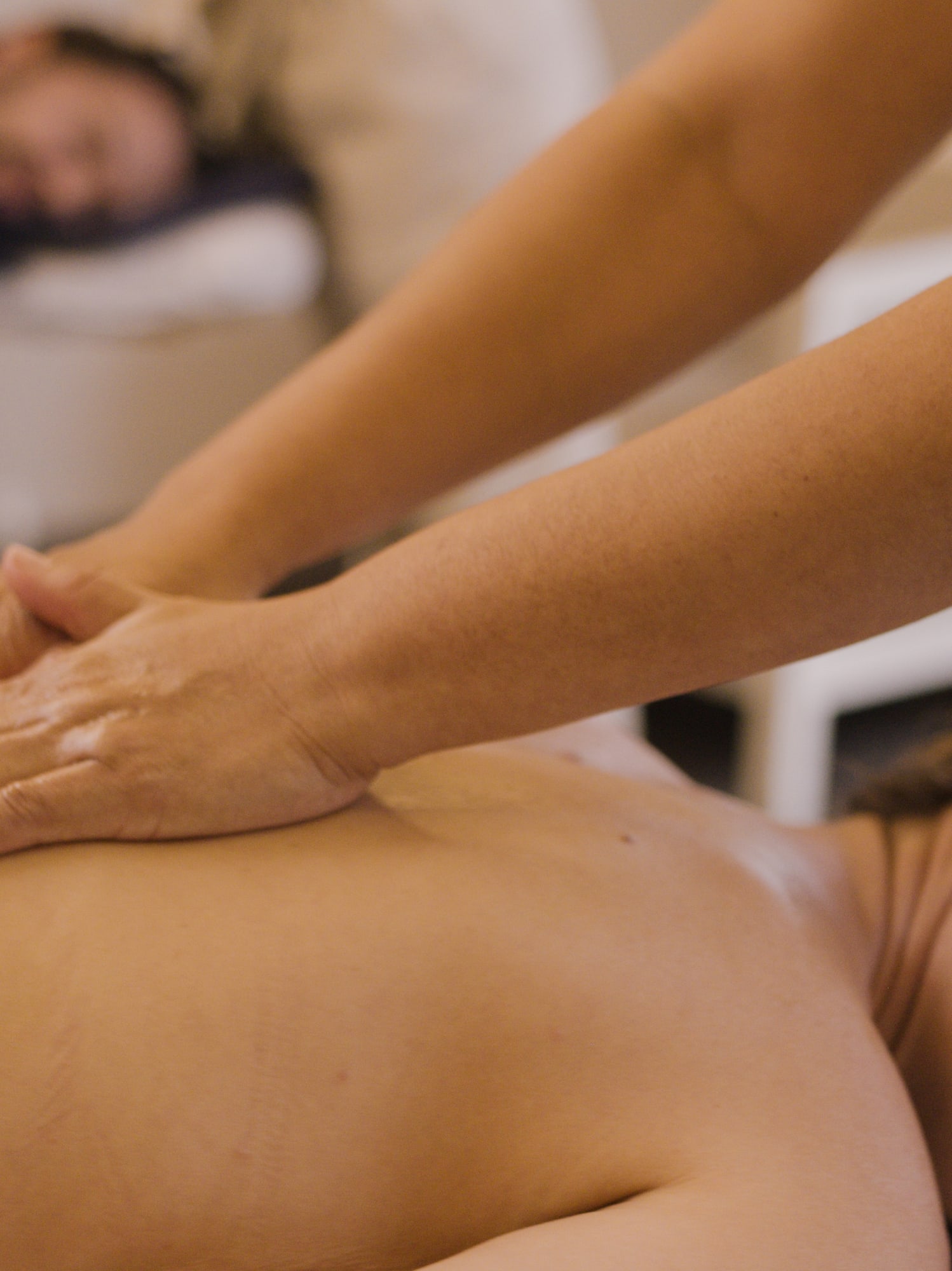 a woman receiving a back massage