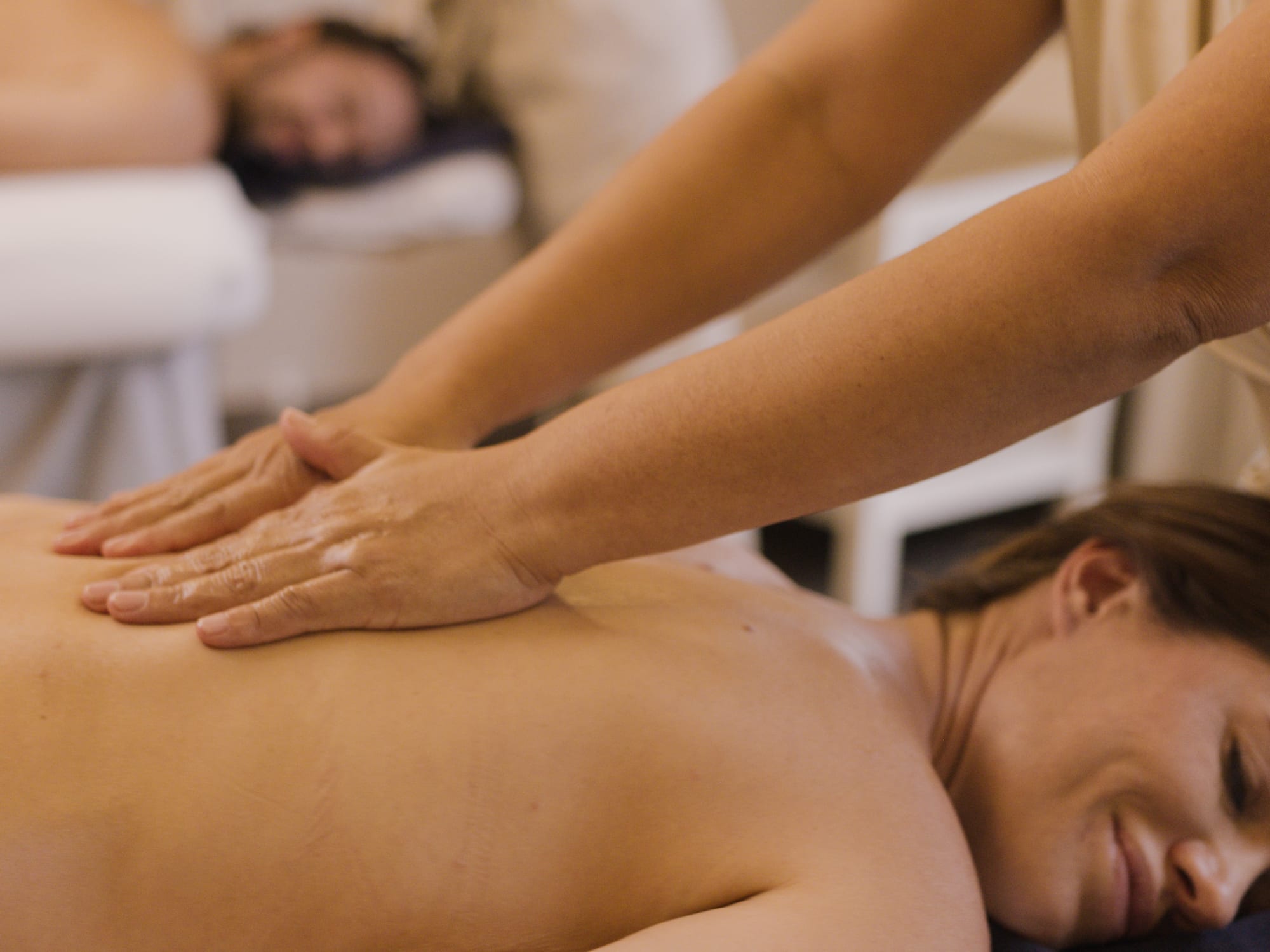 a woman receiving a back massage