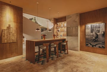 a room with a table and stools