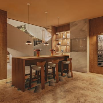 a room with a table and stools