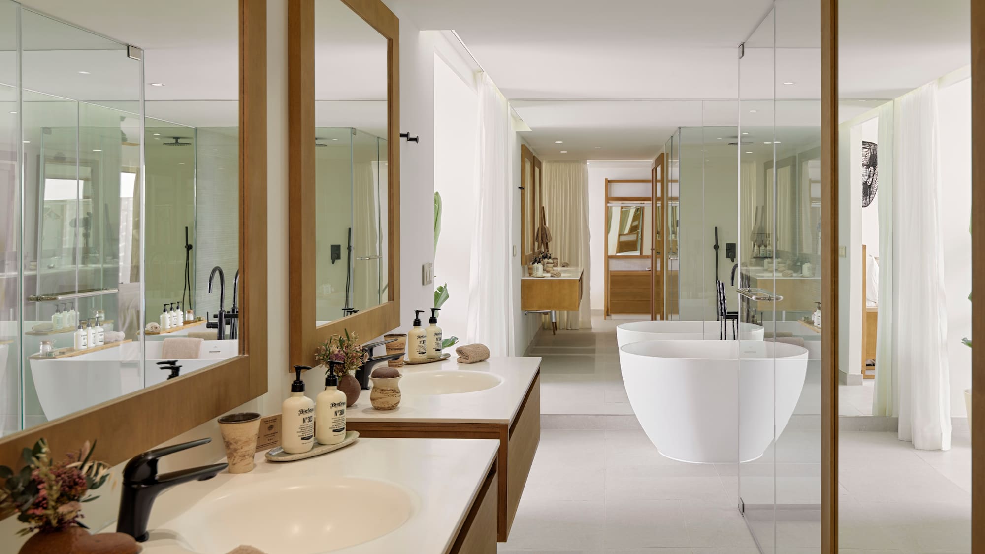 a bathroom with sinks and tub