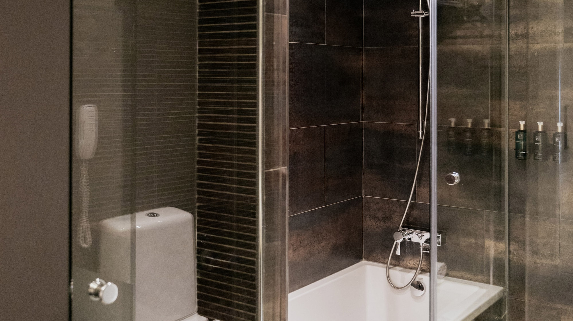 a bathroom with a glass shower door