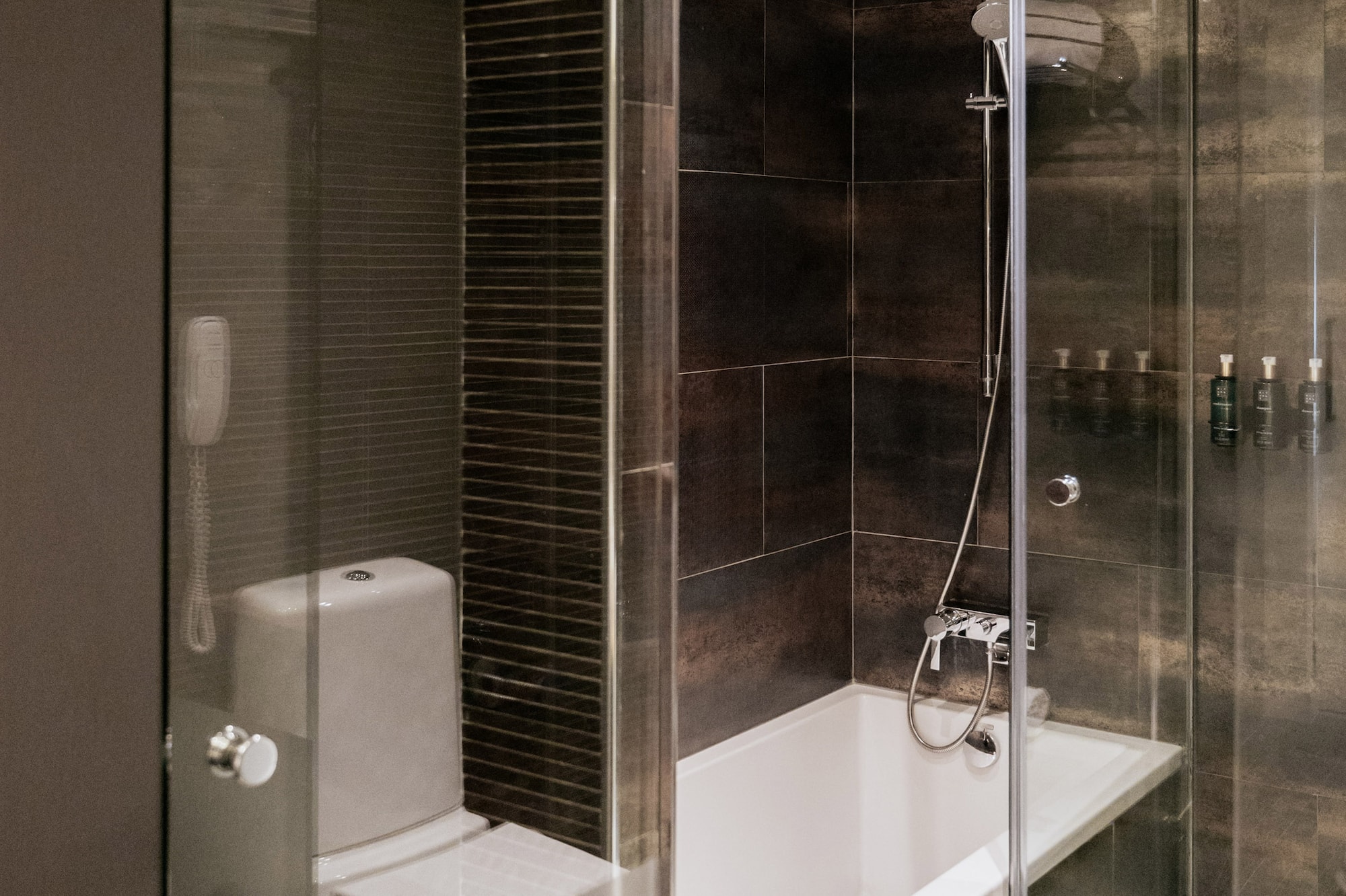 a bathroom with a glass shower door