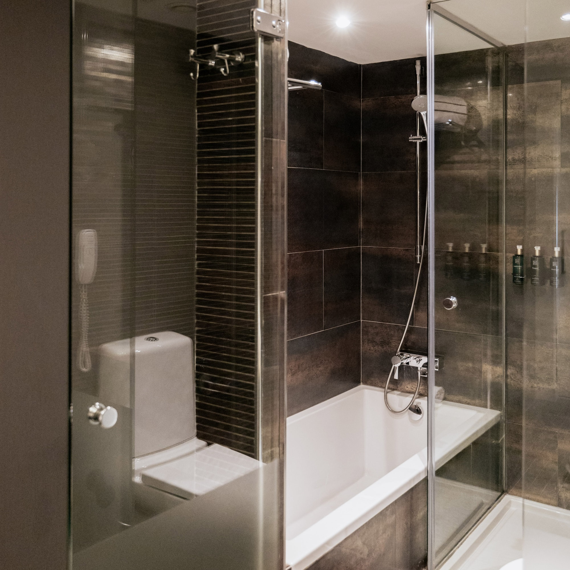 a bathroom with a glass shower door