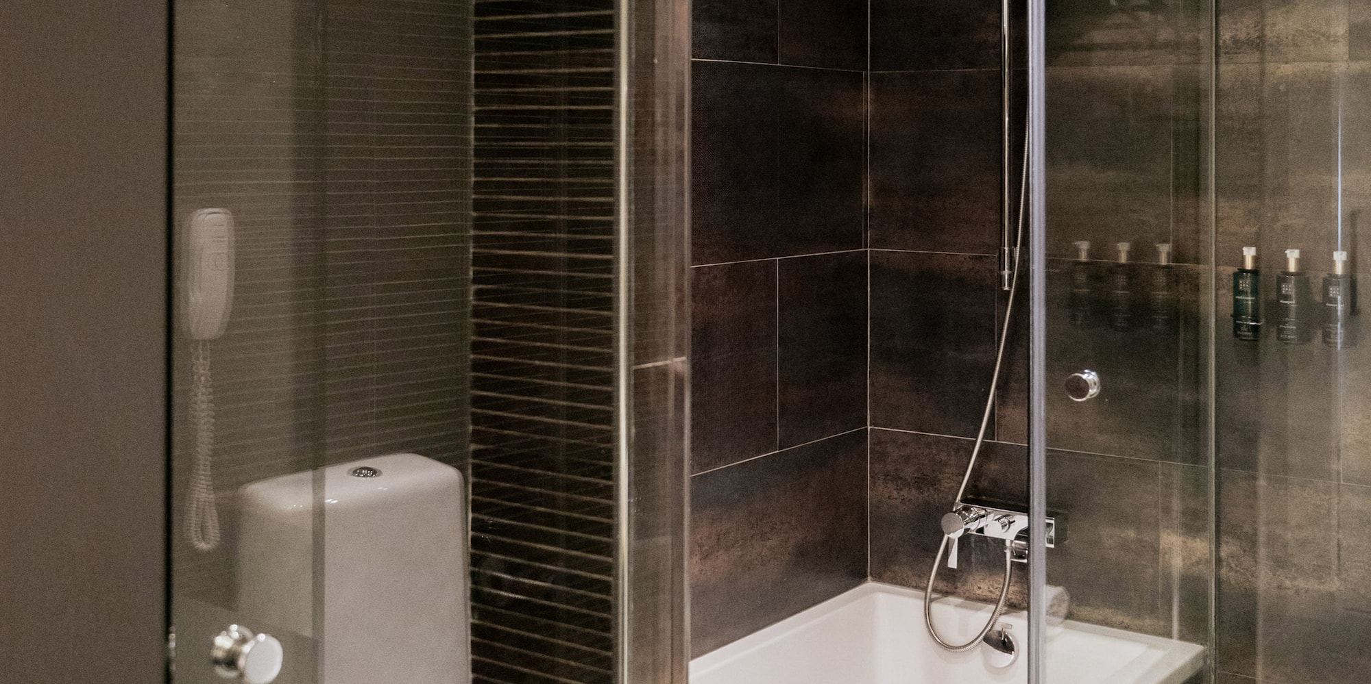 a bathroom with a glass shower door