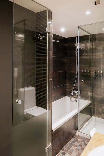 a bathroom with a glass shower door