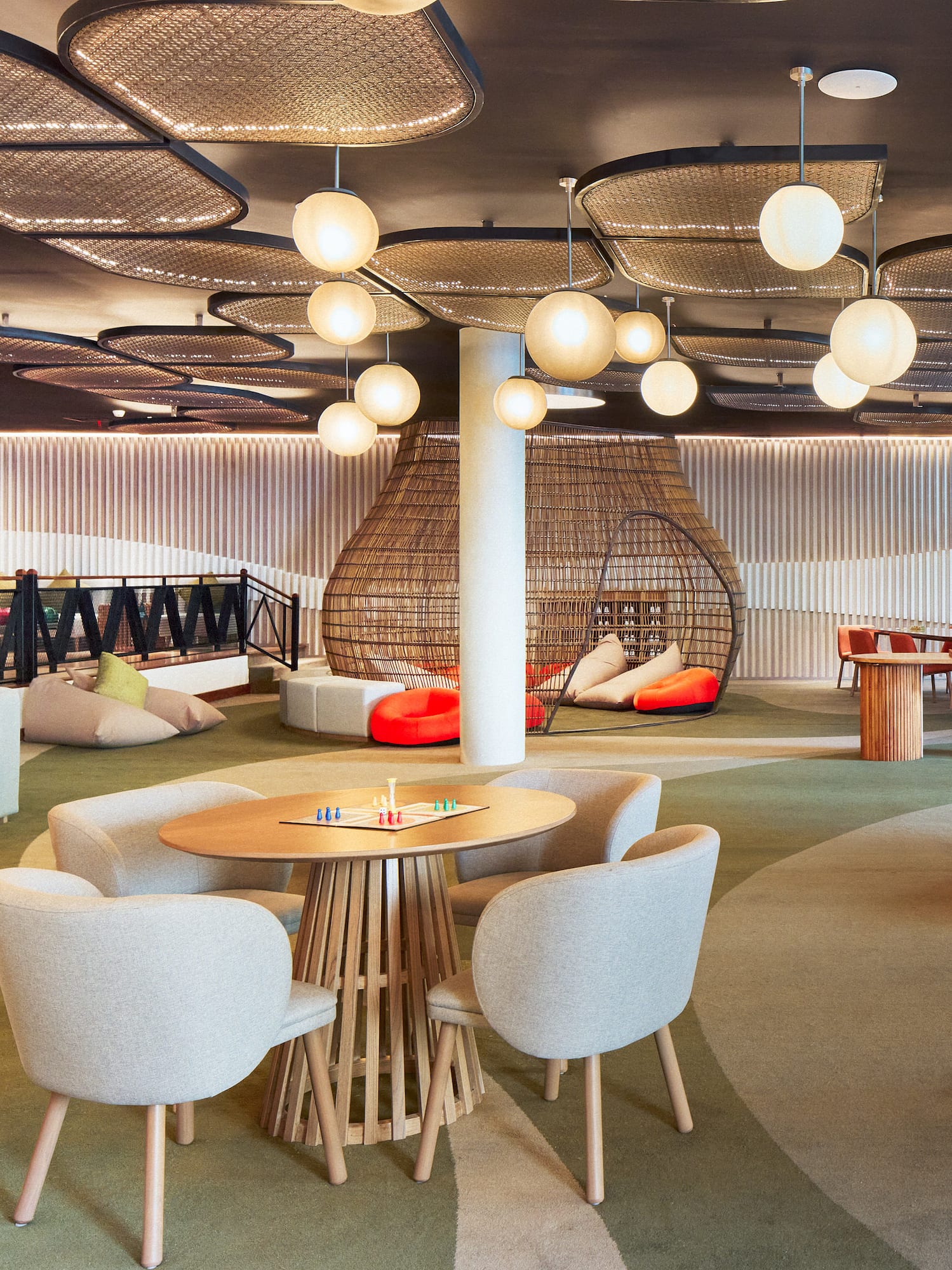 a room with a round table and chairs