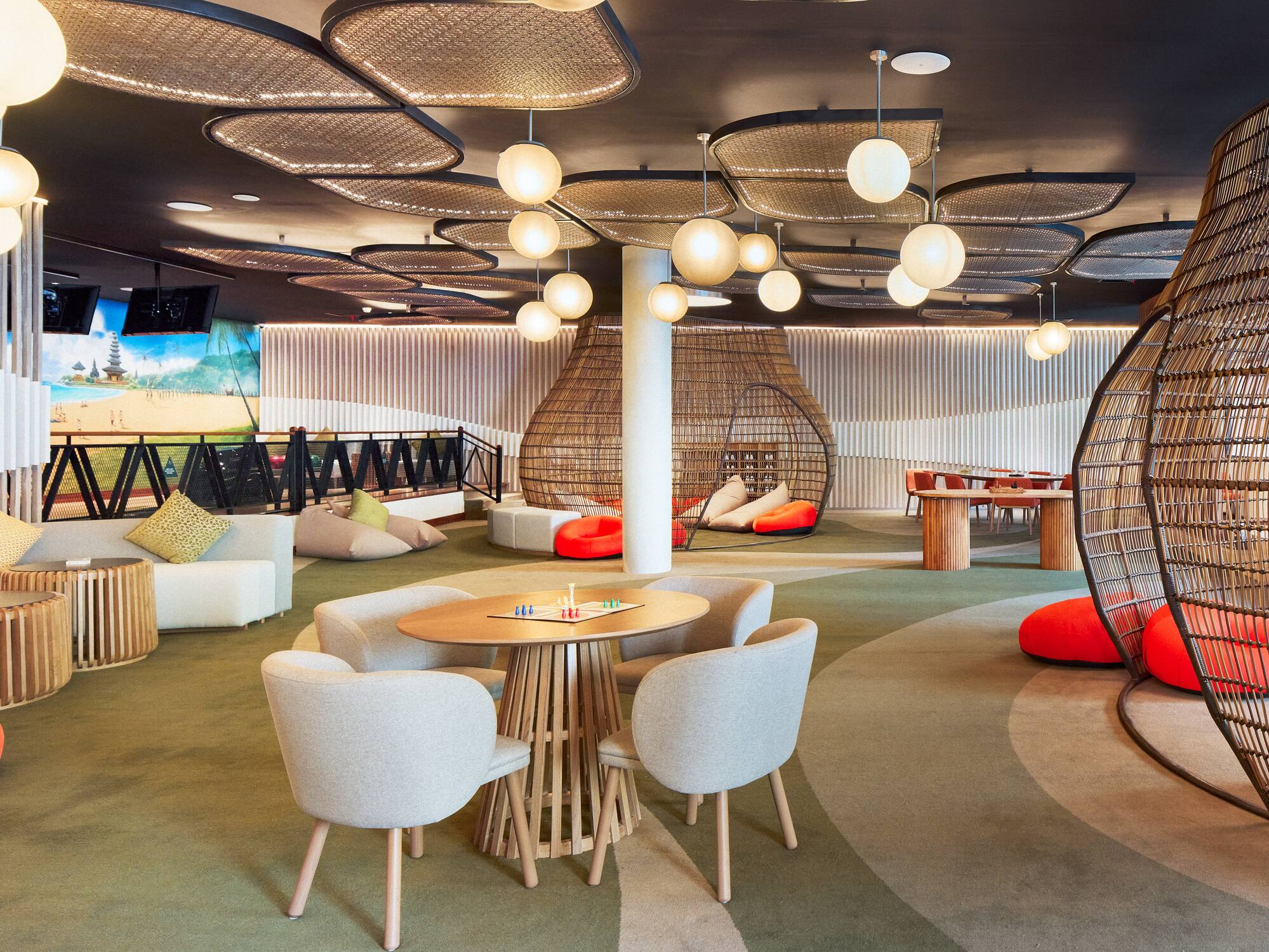 a room with a round table and chairs