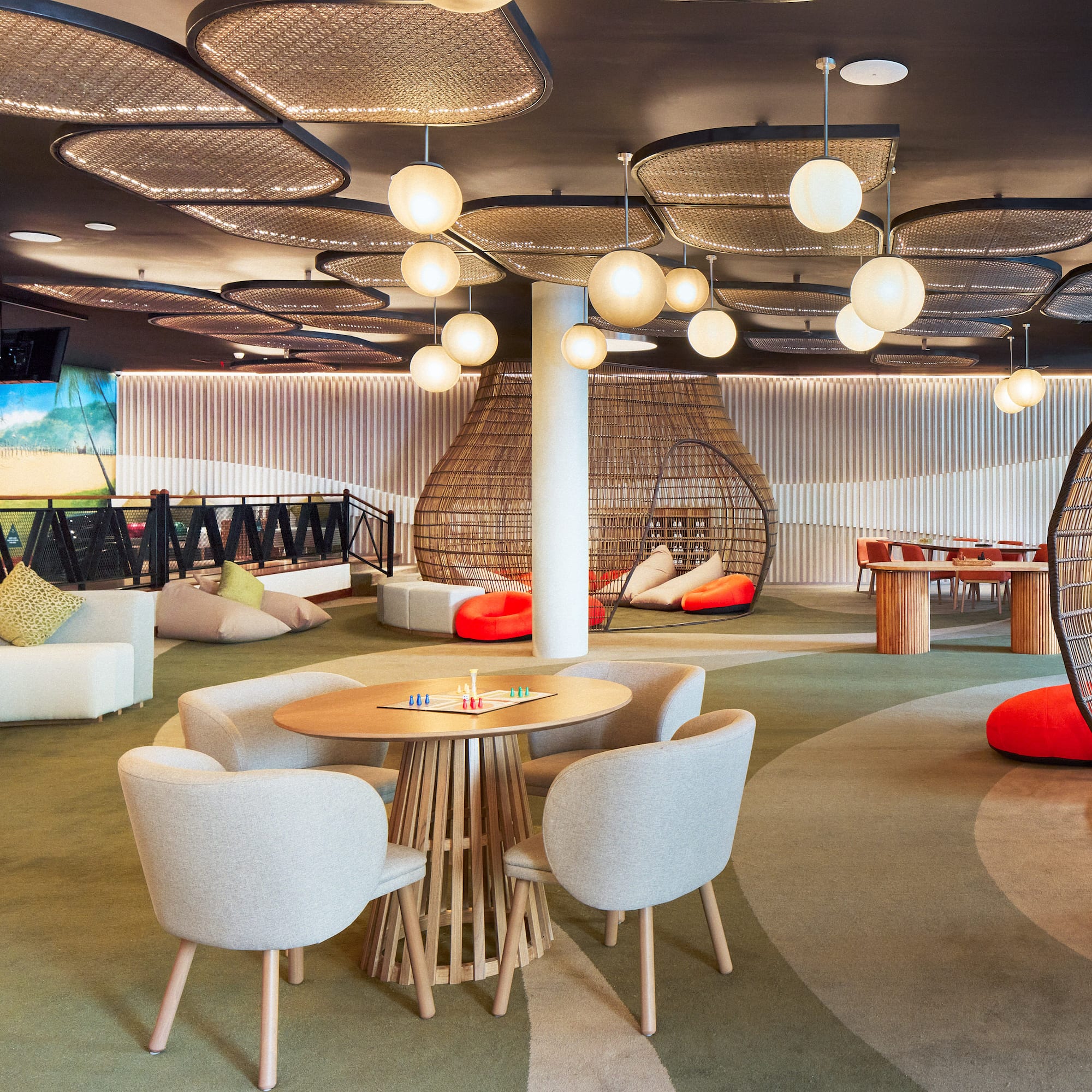 a room with a round table and chairs