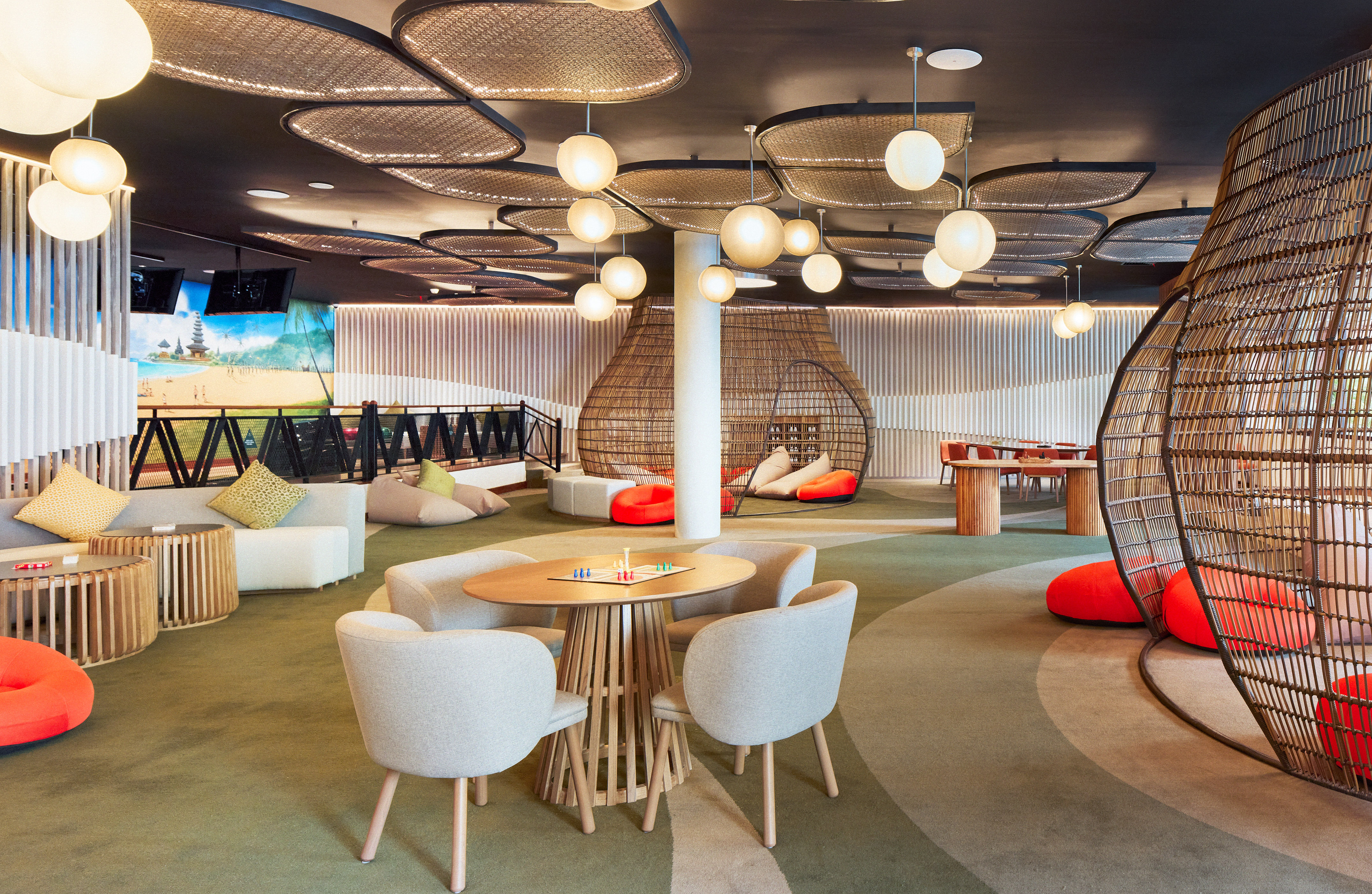 a room with a round table and chairs