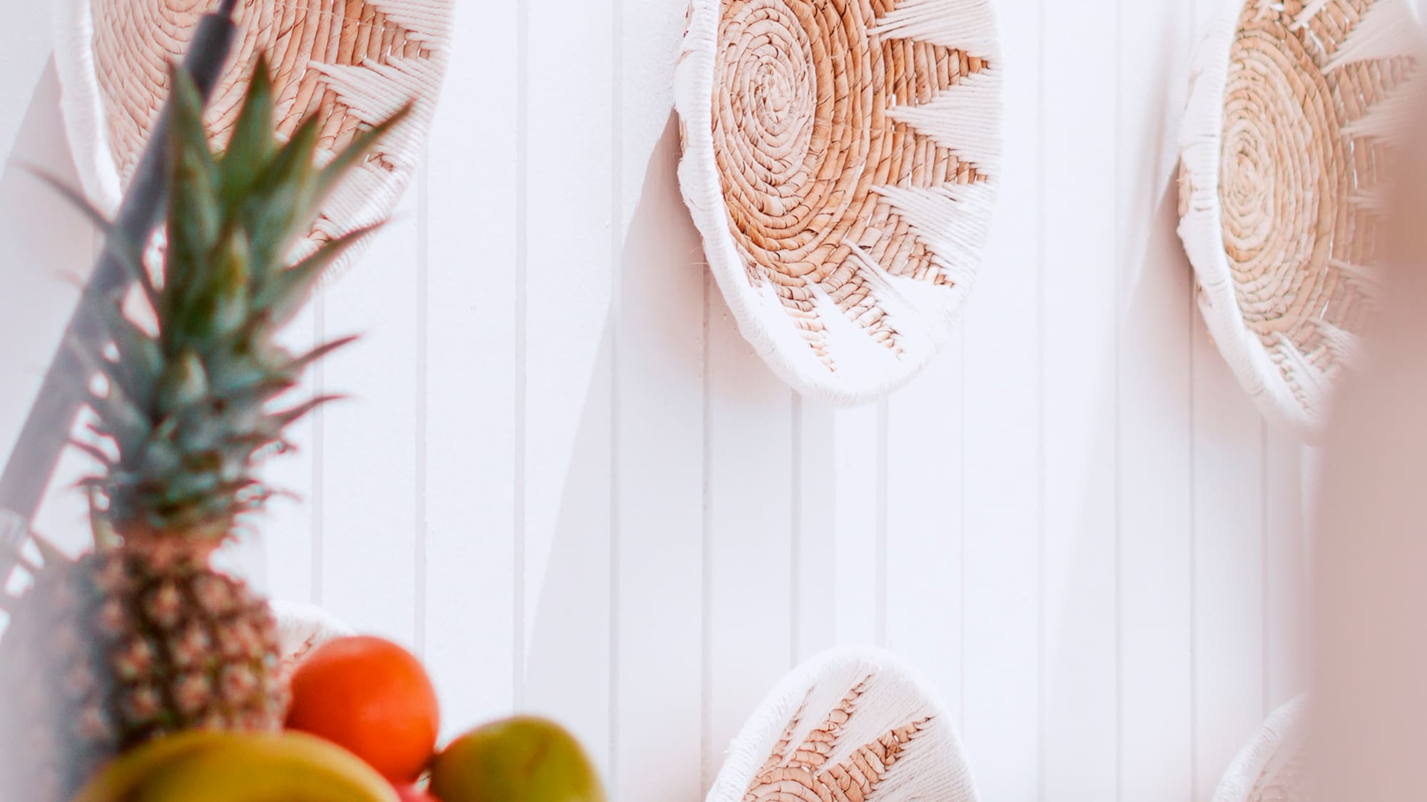 a basket of fruit on a wall