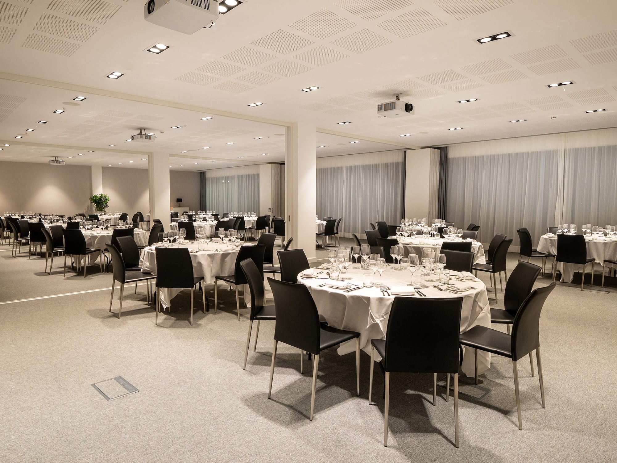 a room with tables and chairs