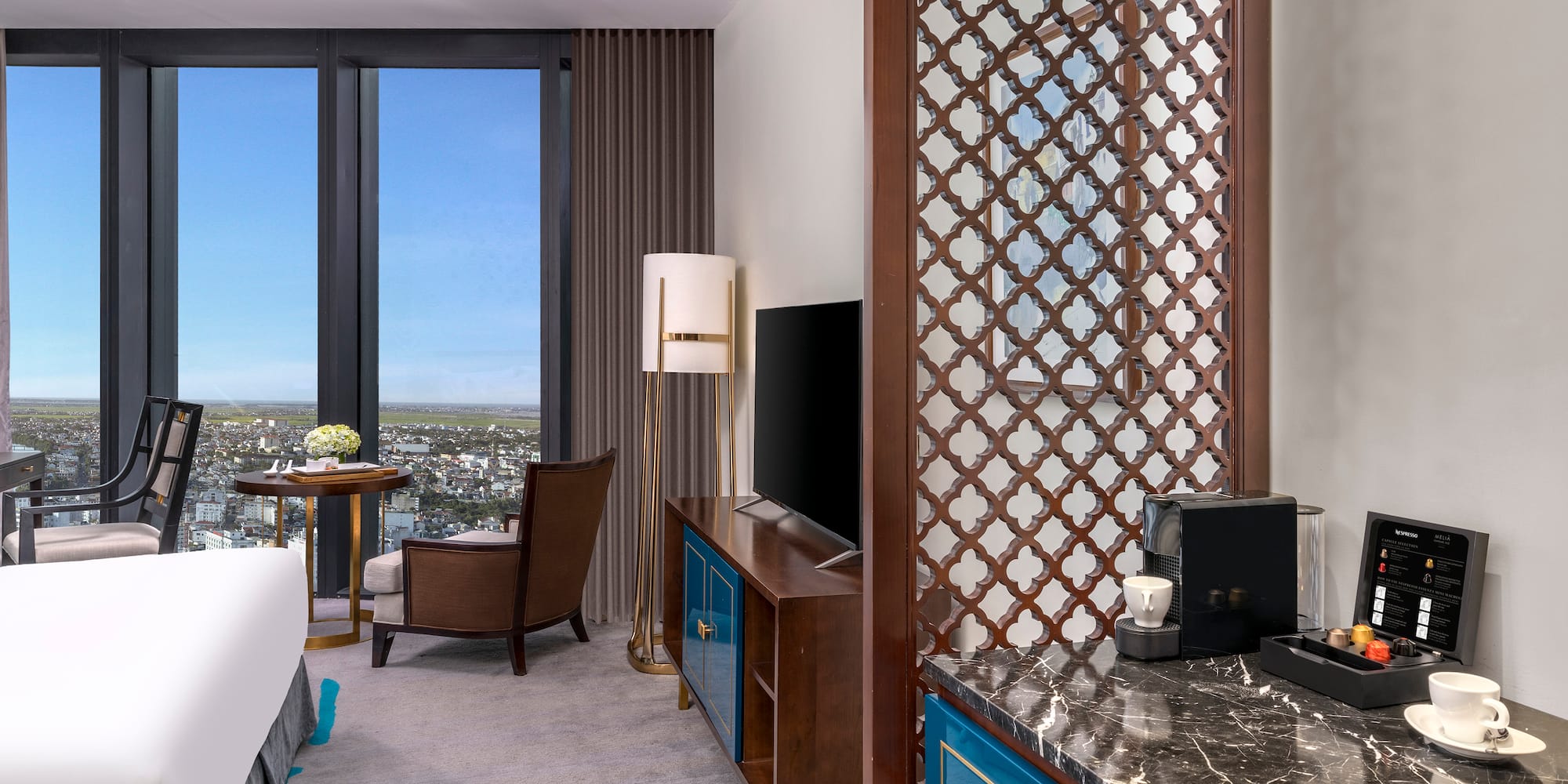 a room with a bed and a tv