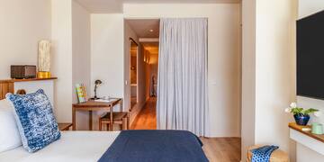 a bedroom with a bed and a table