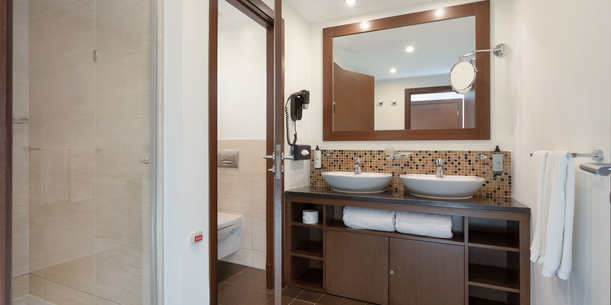 a bathroom with a mirror and sink