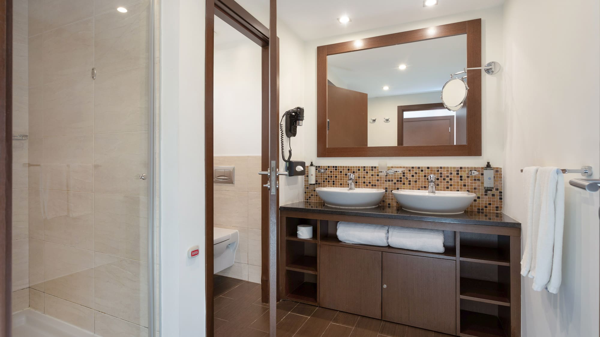 a bathroom with a mirror and sink