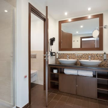 a bathroom with a mirror and sink