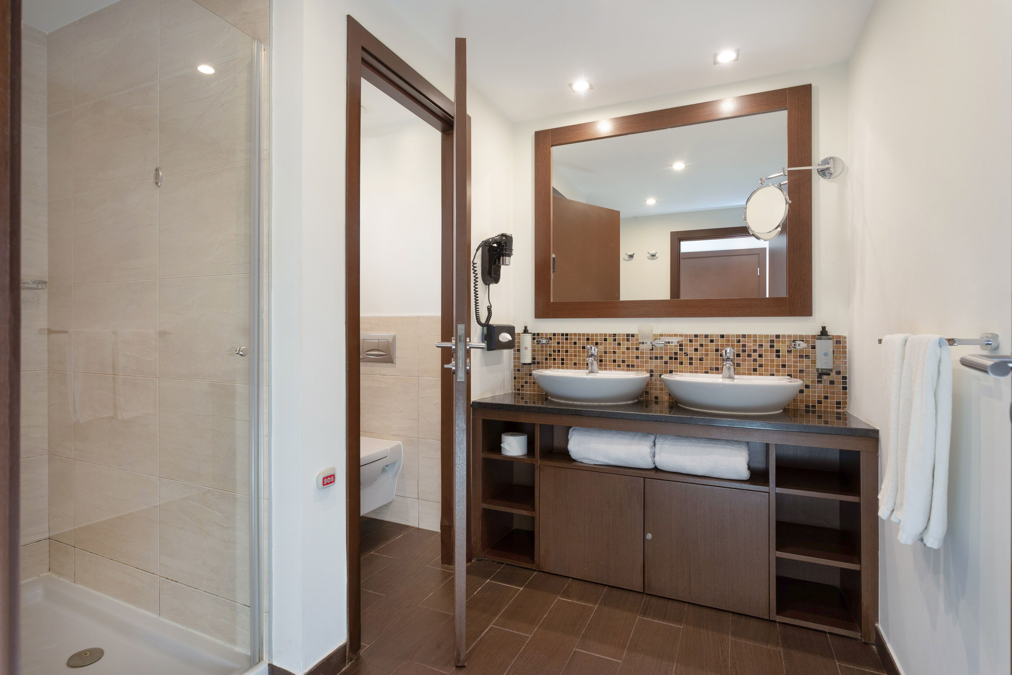 a bathroom with a mirror and sink