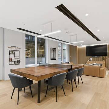 a room with a table and chairs