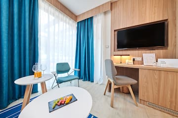 a room with a television and a table