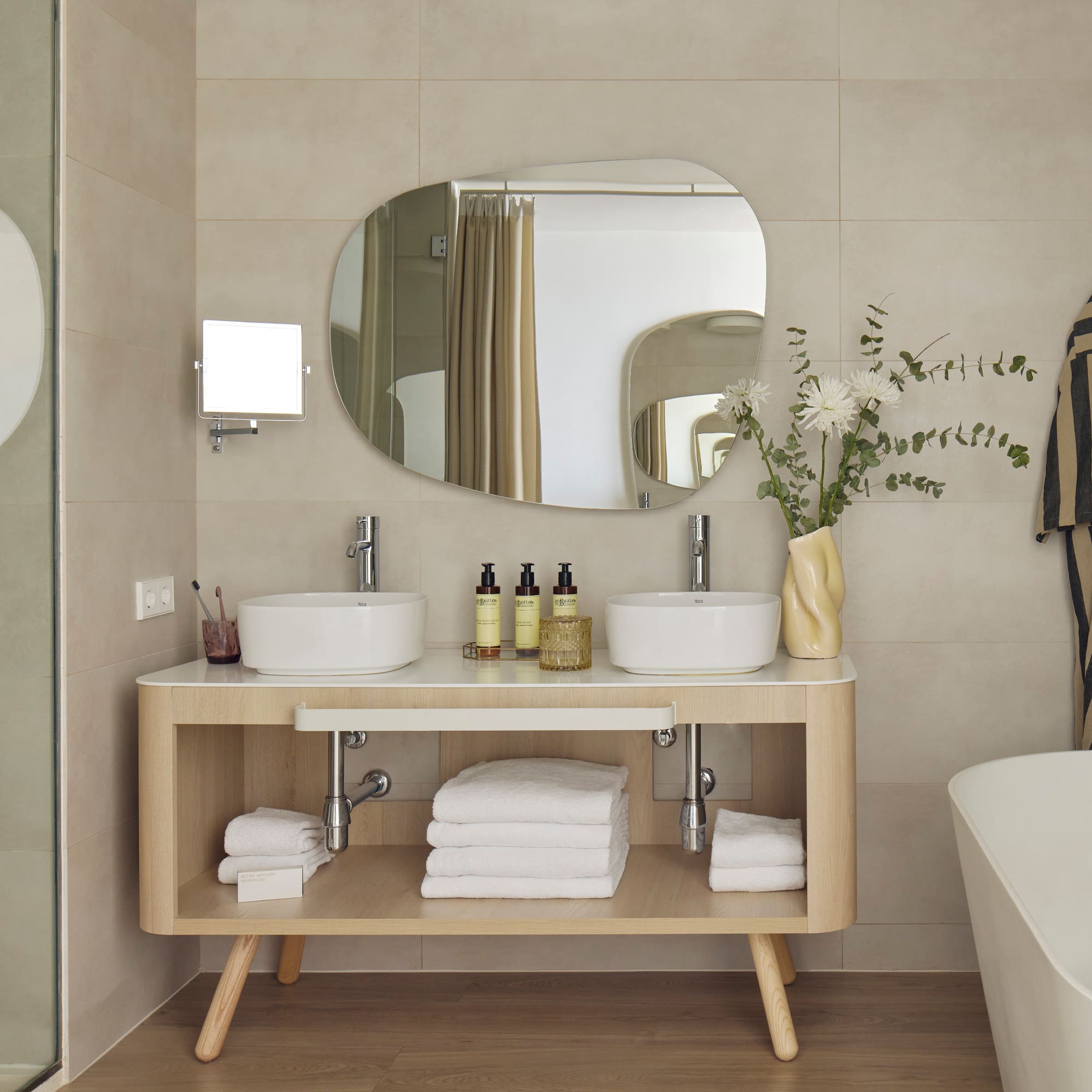 a bathroom with a mirror and sink