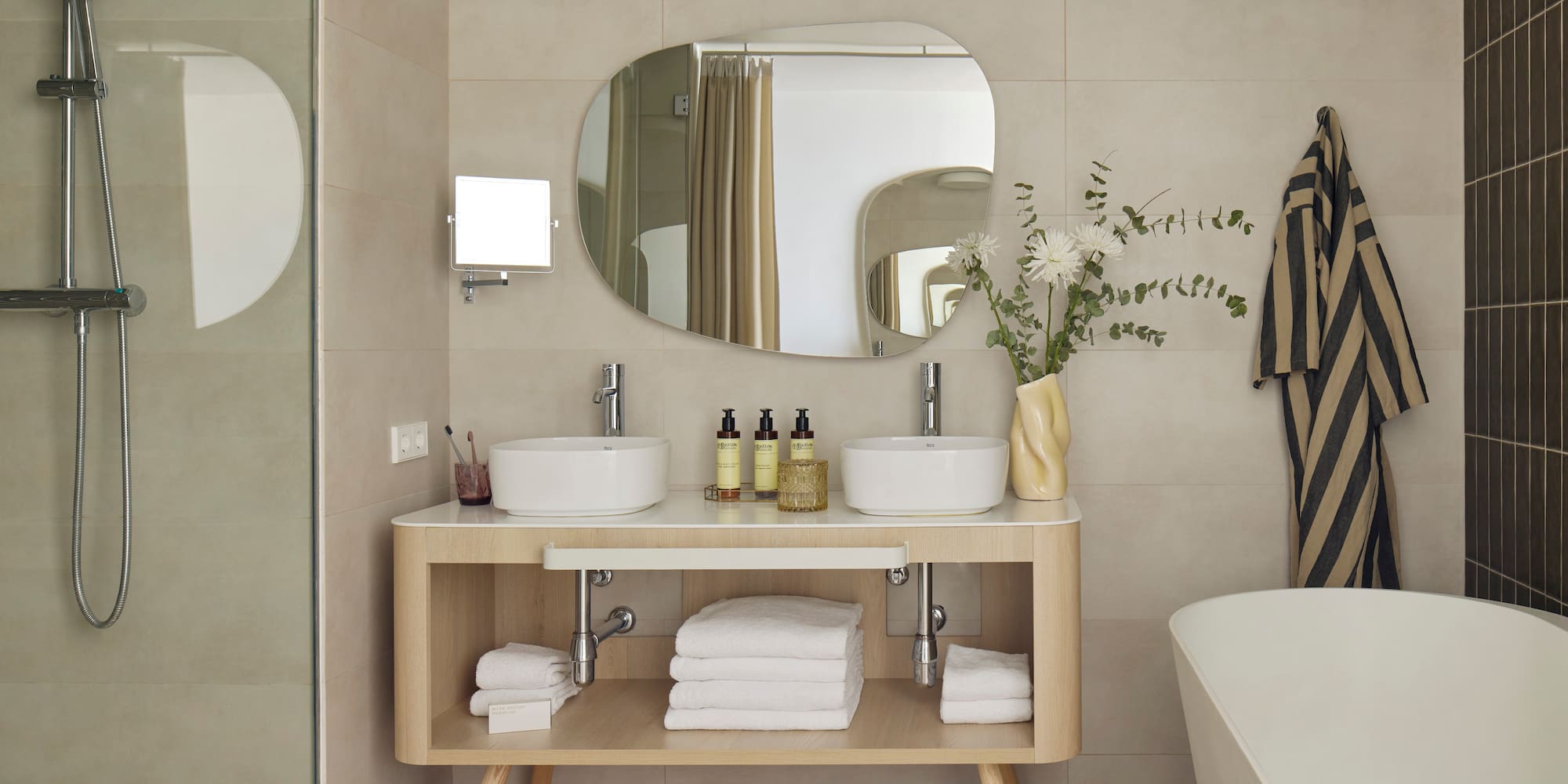 a bathroom with a mirror and sink