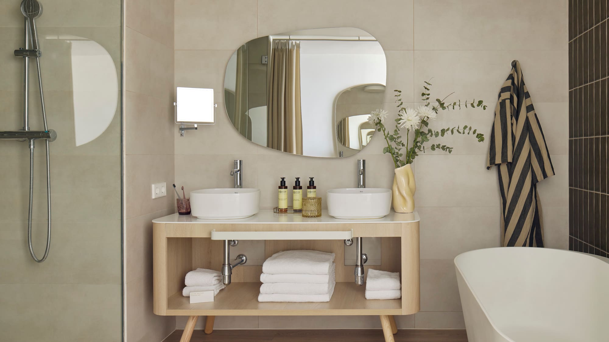 a bathroom with a mirror and sink