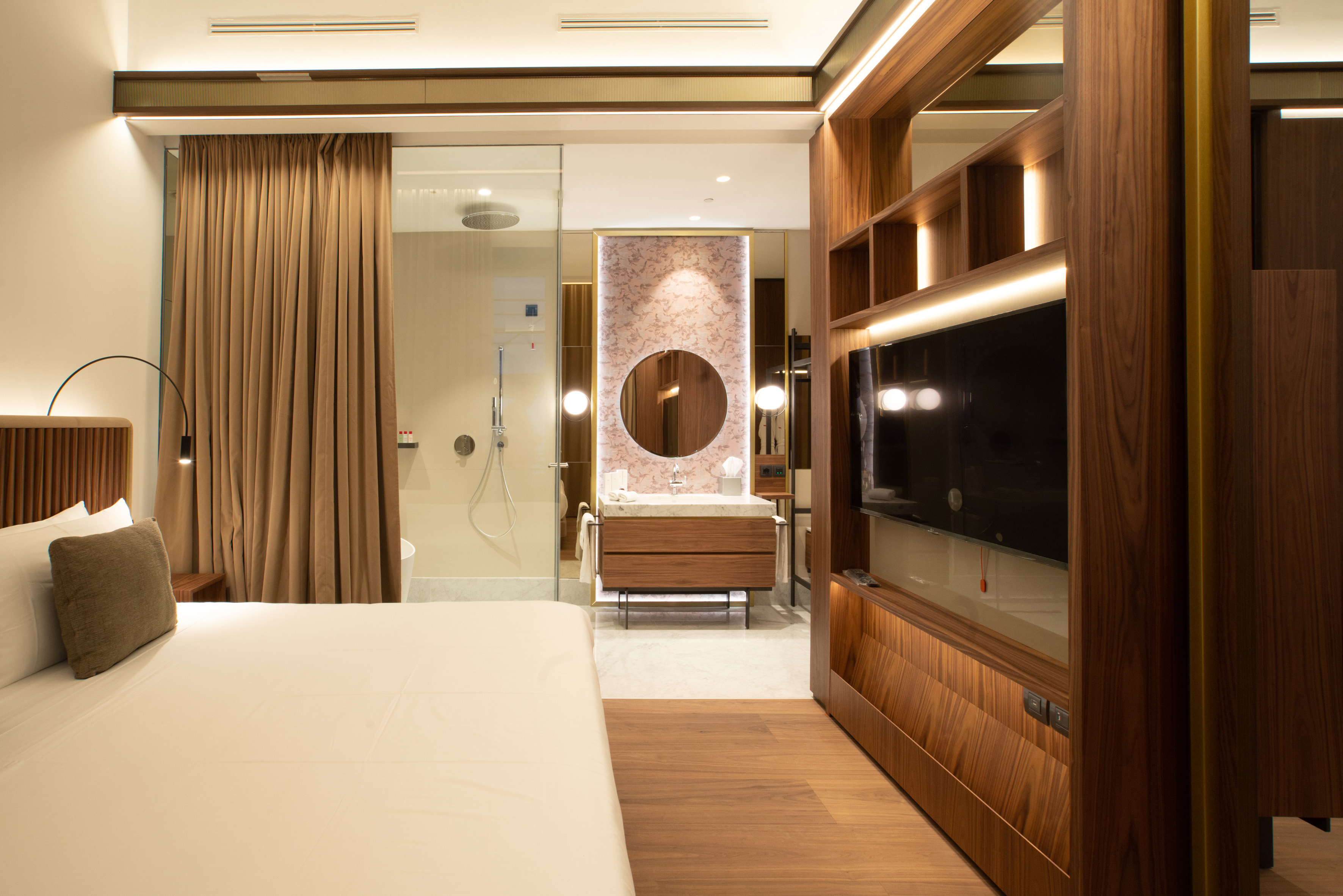 a room with a tv and a sink