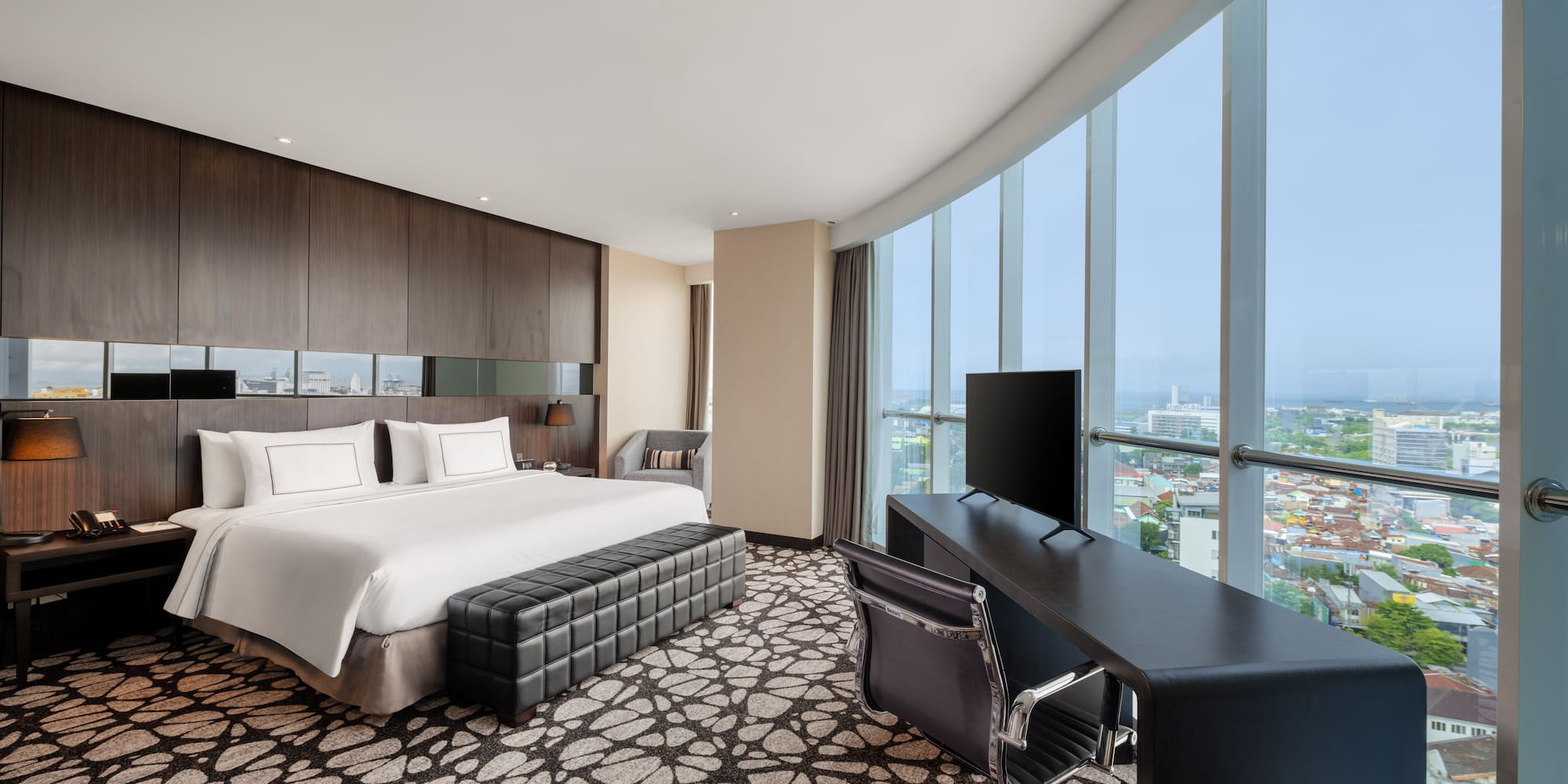 a room with a bed and a desk